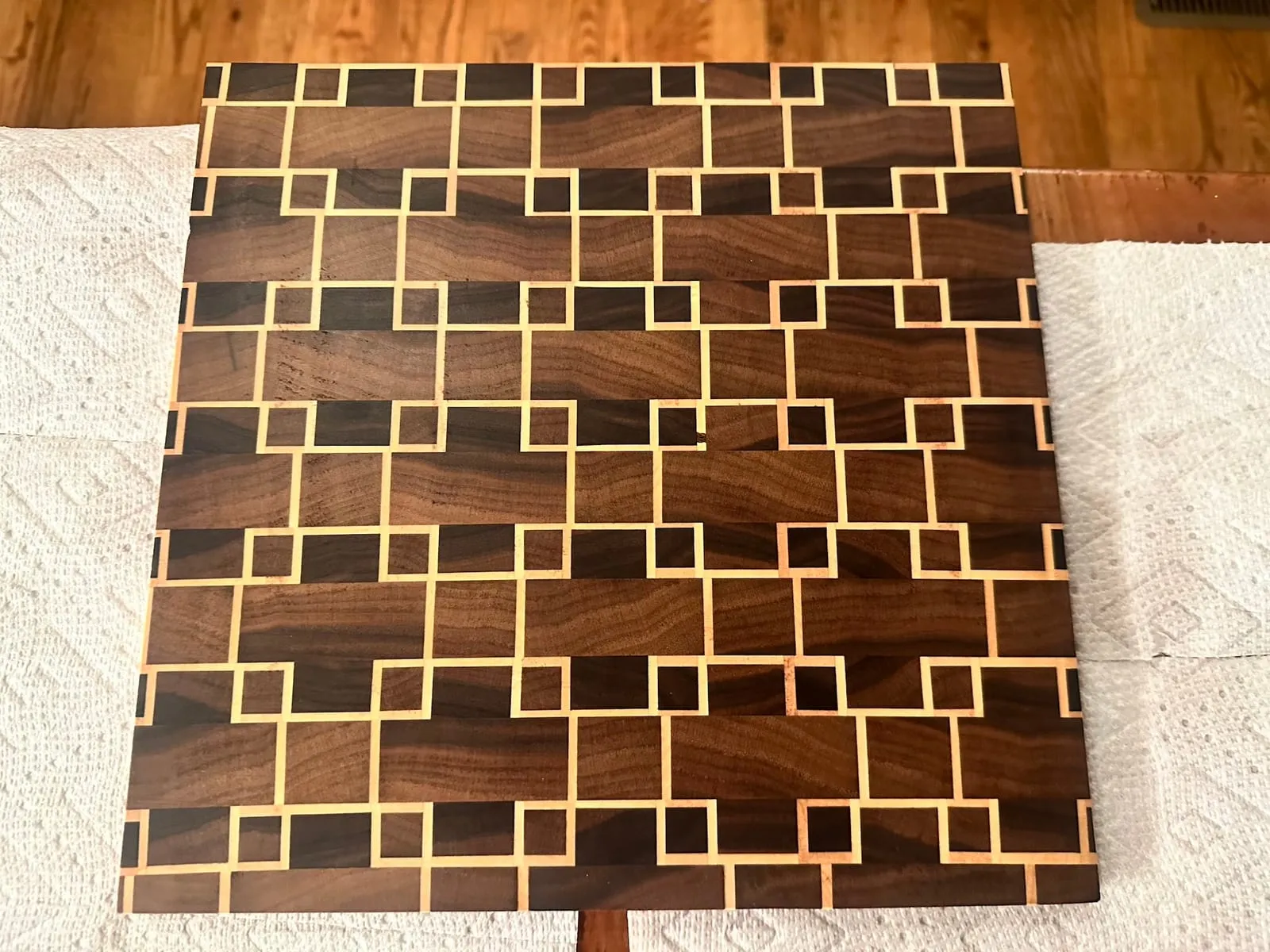 My first end-grain cutting board with maple and walnut